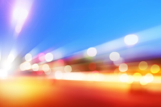 Abstract image of car lights in motion at dusk